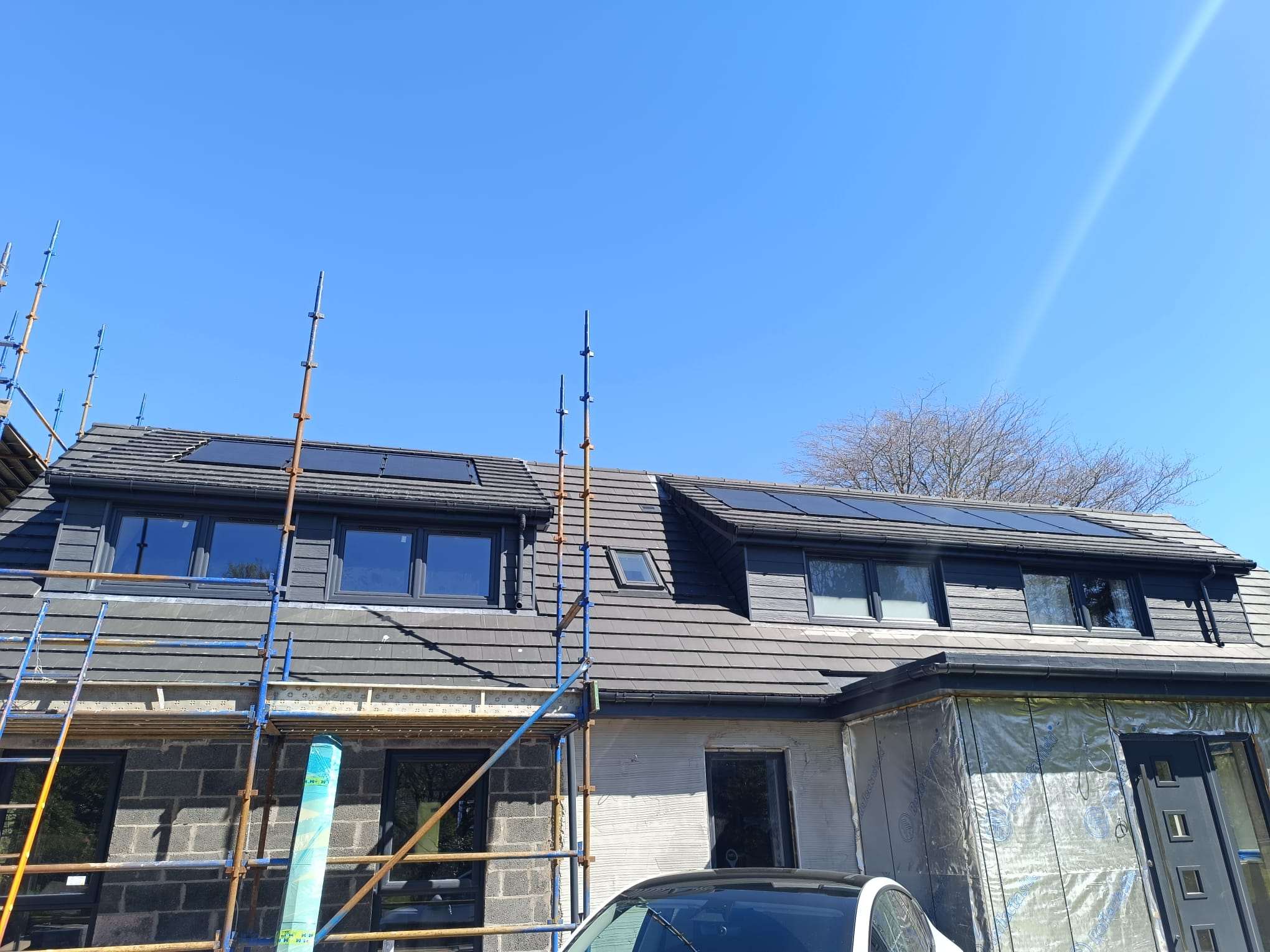In-roof solar panels on a renovated house in Auchterarder under a clear sky