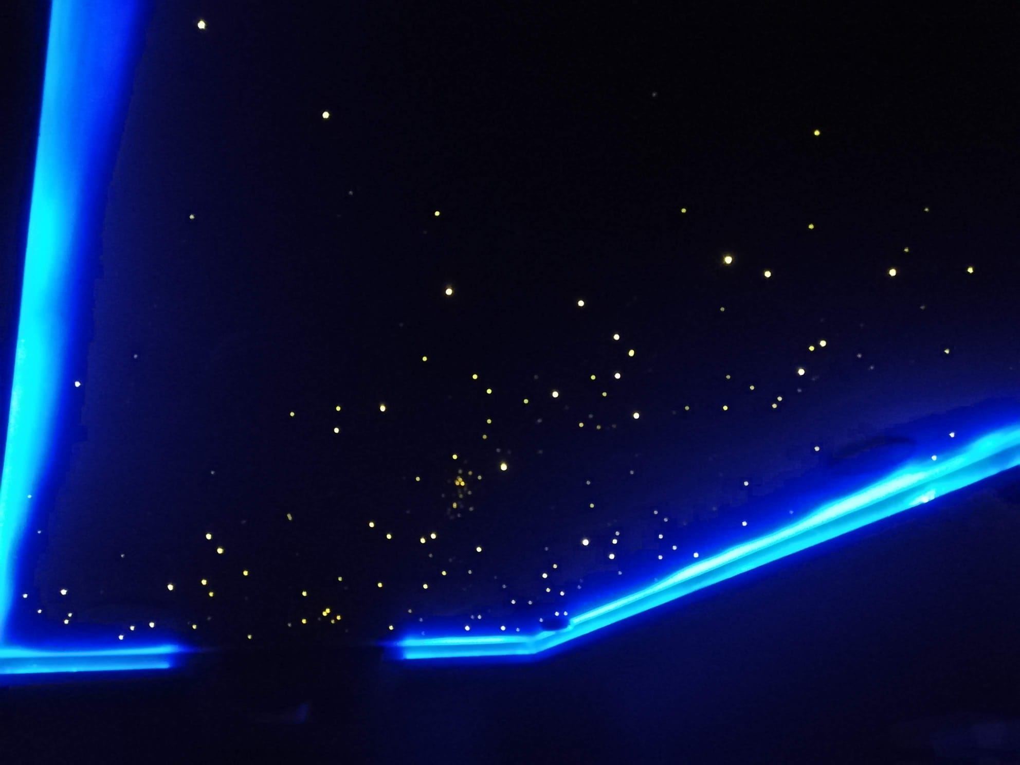 Fibre-optic star ceiling with blue LED cove lighting around its edge